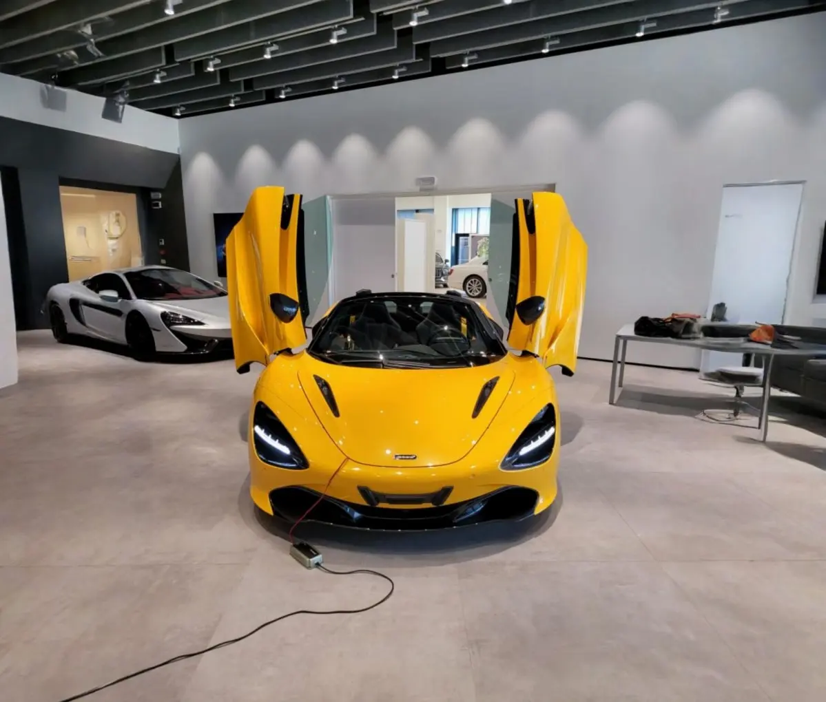McLaren 720S Spider 2022, exterior — Cannes Lux Car Rental, Cannes. Open-top through Mougins toward Grasse hilltop light