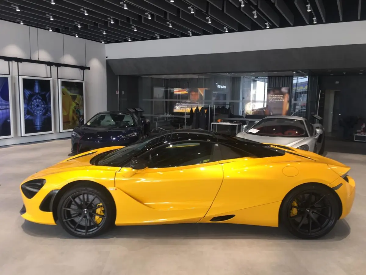 McLaren 720S Spider 2022, rear view — Cannes Lux Car Rental, Cannes. Open-top through Mougins toward Grasse hilltop light